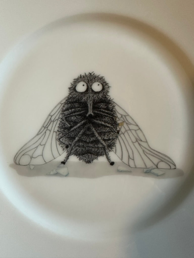 Teller Fliege mit Goldrand